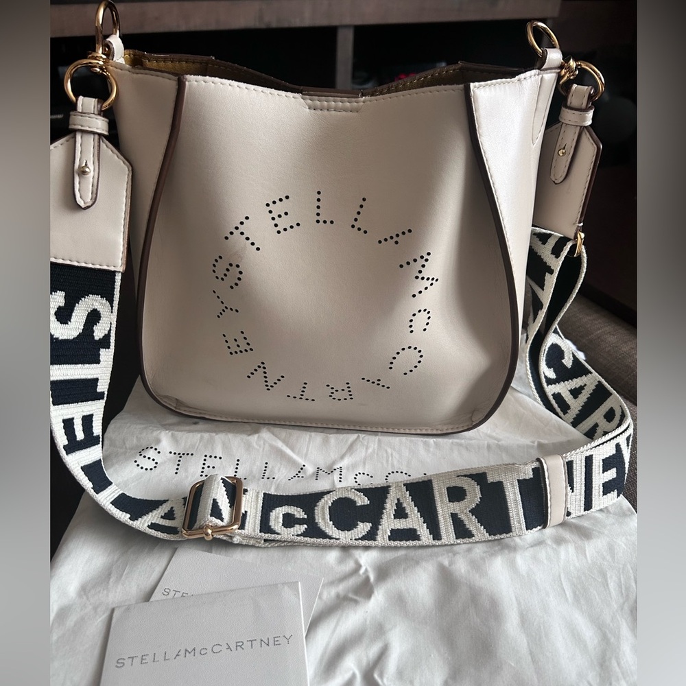 Stella McCartney logo at the front and a canvas shoulder strap.